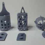 Impresión en 3D de jaulas para pájaros a partir de fotopolímero elástico gris. Pieza impresa en 3D | 3D printing of bird cages from grey elastic photopolymer. 3D printed part