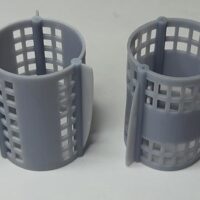 Impresión en 3D de jaulas para pájaros a partir de fotopolímero elástico gris. Pieza impresa en 3D | 3D printing of bird cages from grey elastic photopolymer. 3D printed part